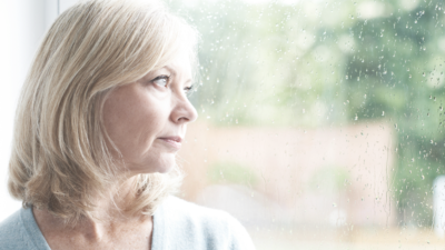 woman with breast implant associated lymphoma starting out a window